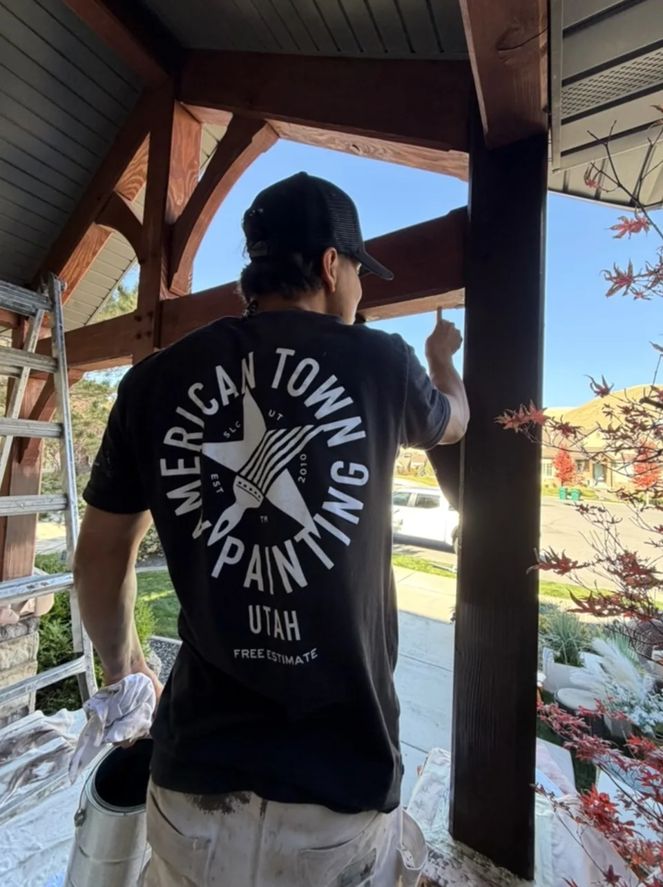 American Town Painting crew staining a covered porch